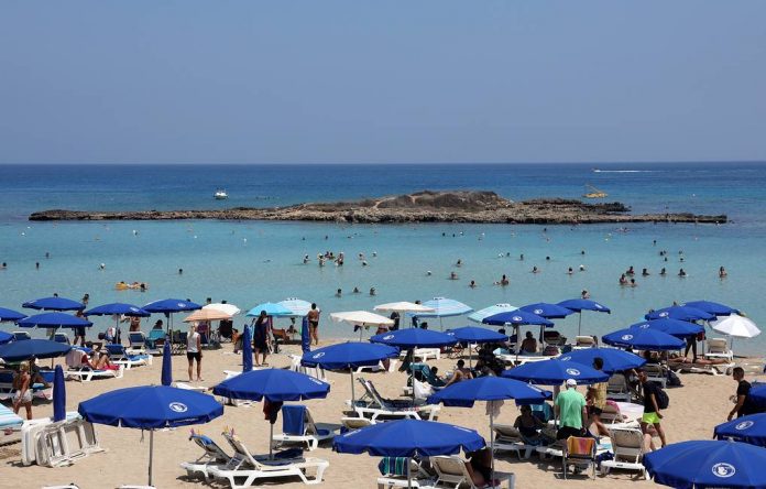 Tourists and locals at the beach in Protaras Cyprus
