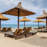 Black Sea, Romania. Straw umbrellas on the beach in Mamaia.