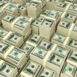 Hundred dollar bills money pile.