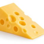 Delicious piece of cheese, isolated on white background