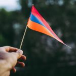 Armenian flag in human hands