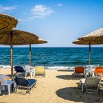 Beautiful Seascape With Beach Umbrellas And Sunbeds in Stavros, Greece