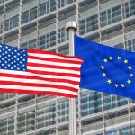 USA and European flags waving in the wind (3D rendered)