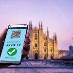 traveler-holds-vaccine-passport-certificate-show-covid-19-vaccination-status_31965-13999