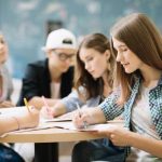 team-of-students-completing-task_23-2147666610